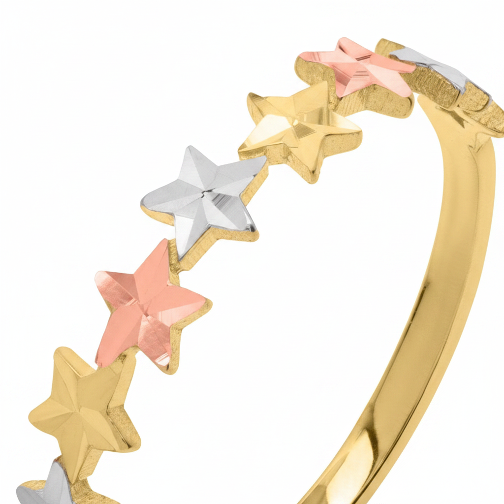 Close-up of 10k tri-color gold star band ring showing diamond-cut detail