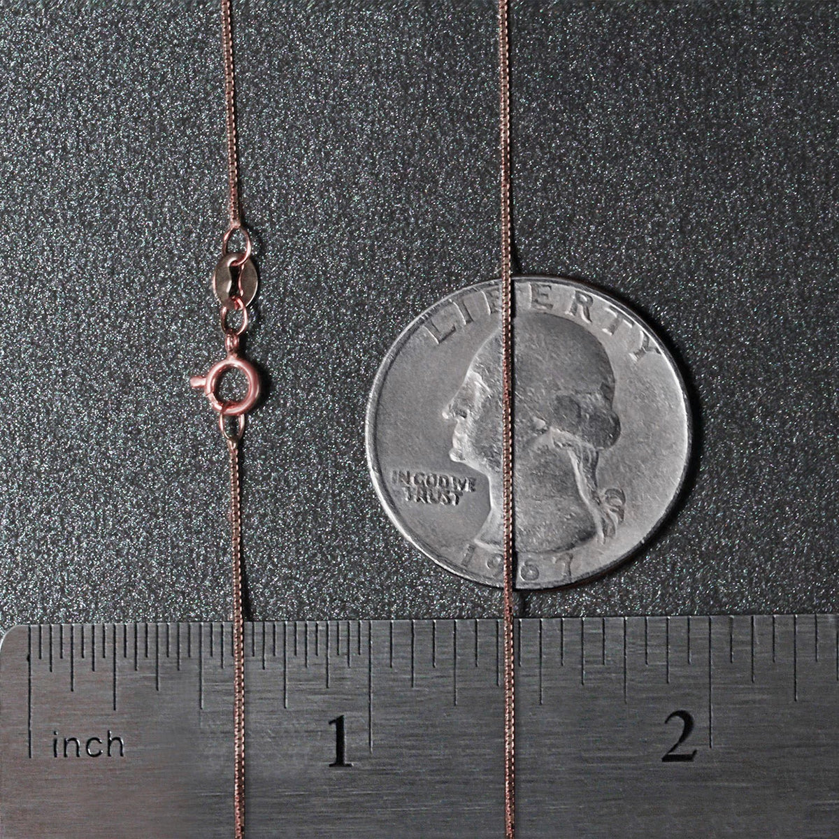 14K rose gold box chain layered with other fine gold necklaces