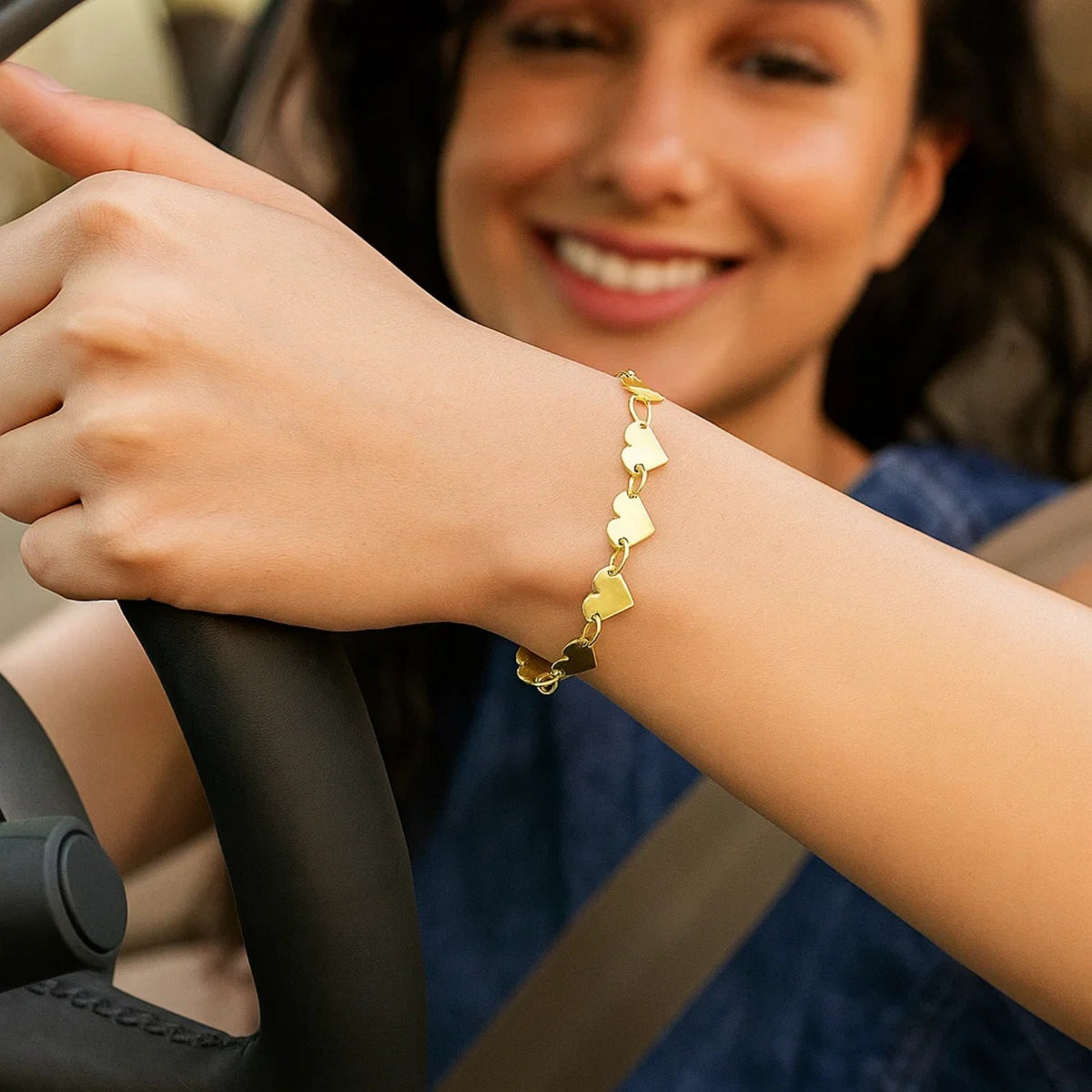 Close-up of 10K gold mirror heart chain bracelet clasp and heart link detail