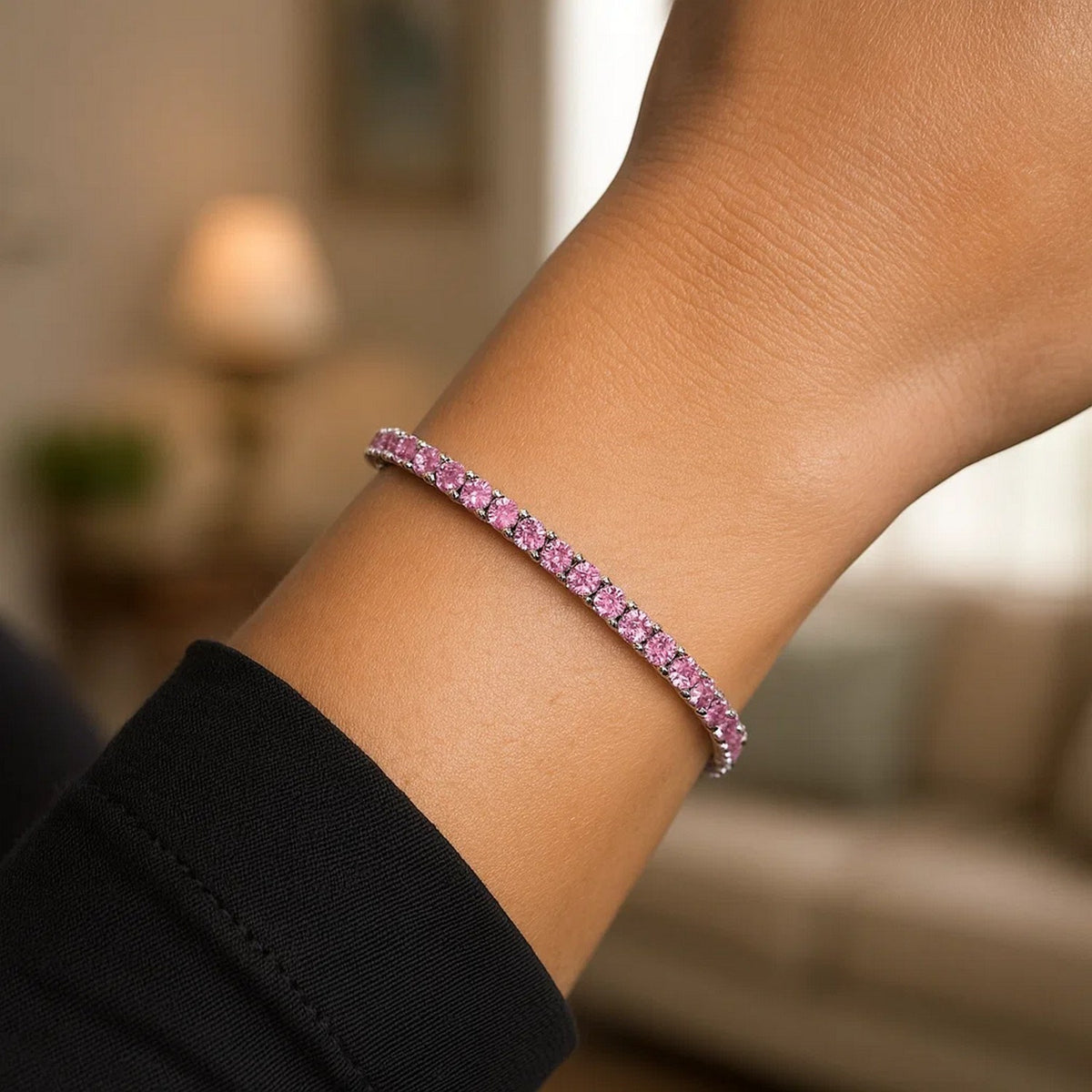 Pink CZ tennis bracelet worn on wrist lifestyle shot