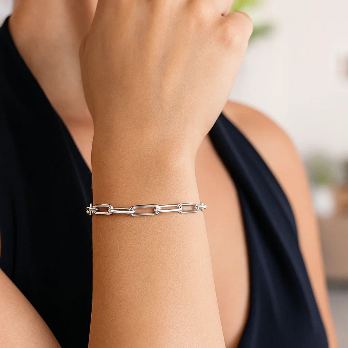 Polished Sterling Silver 925 modern link paperclip chain adjustable bracelet with drawing string closure.