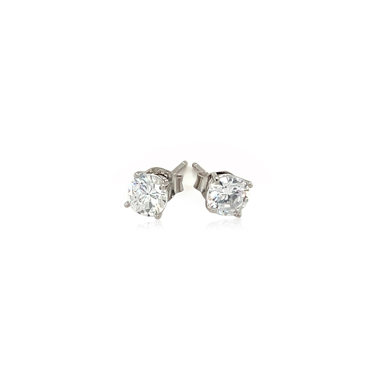 Close-up detail of 5mm round cubic zirconia stud earring in sterling silver four-prong setting