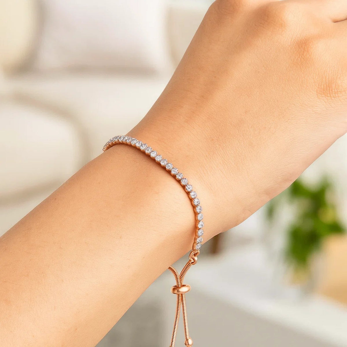 Adjustable cubic zirconia tennis bracelet in sterling silver worn on wrist, gifts for women
