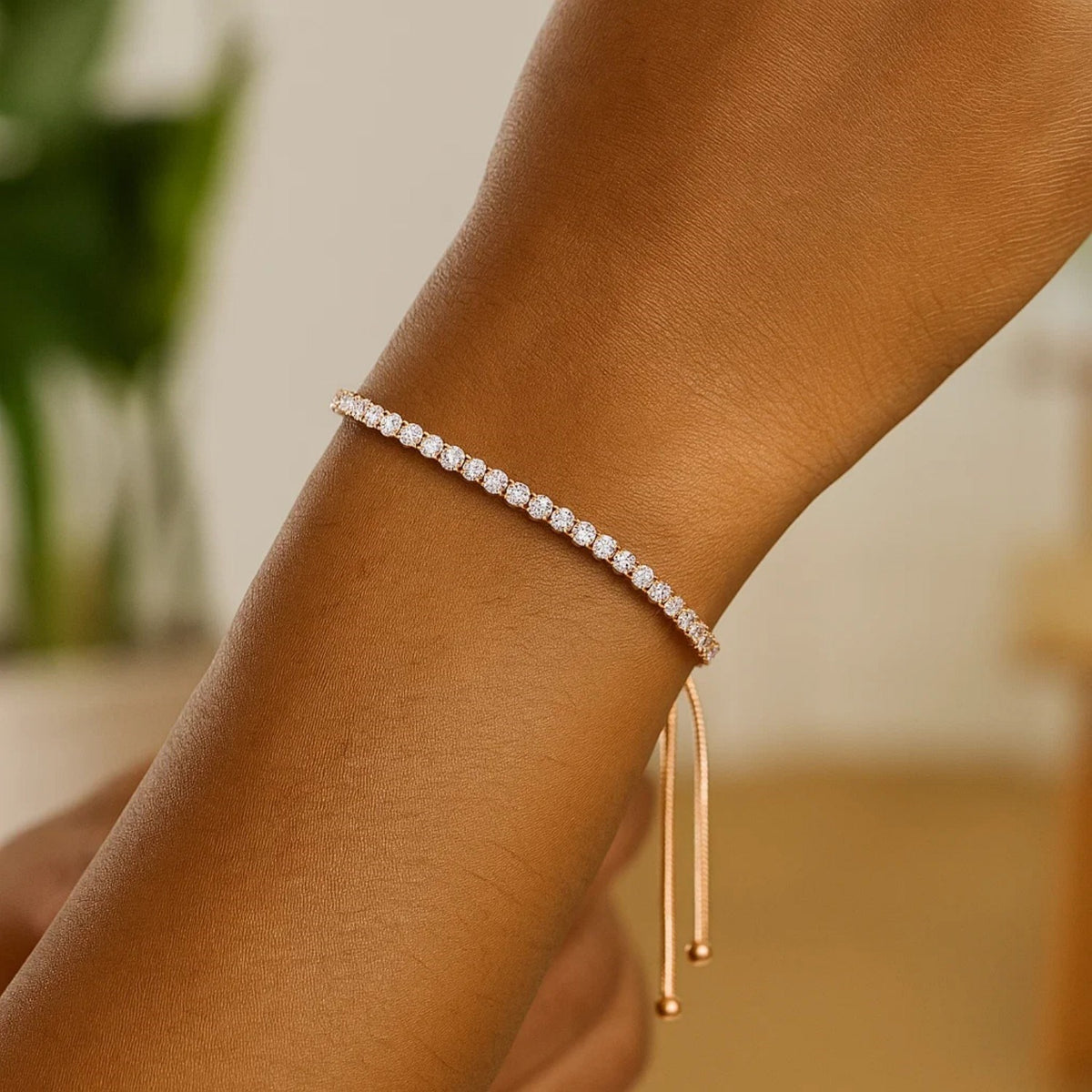 Close-up of adjustable CZ tennis bracelet in rhodium-polished 925 sterling silver on wrist