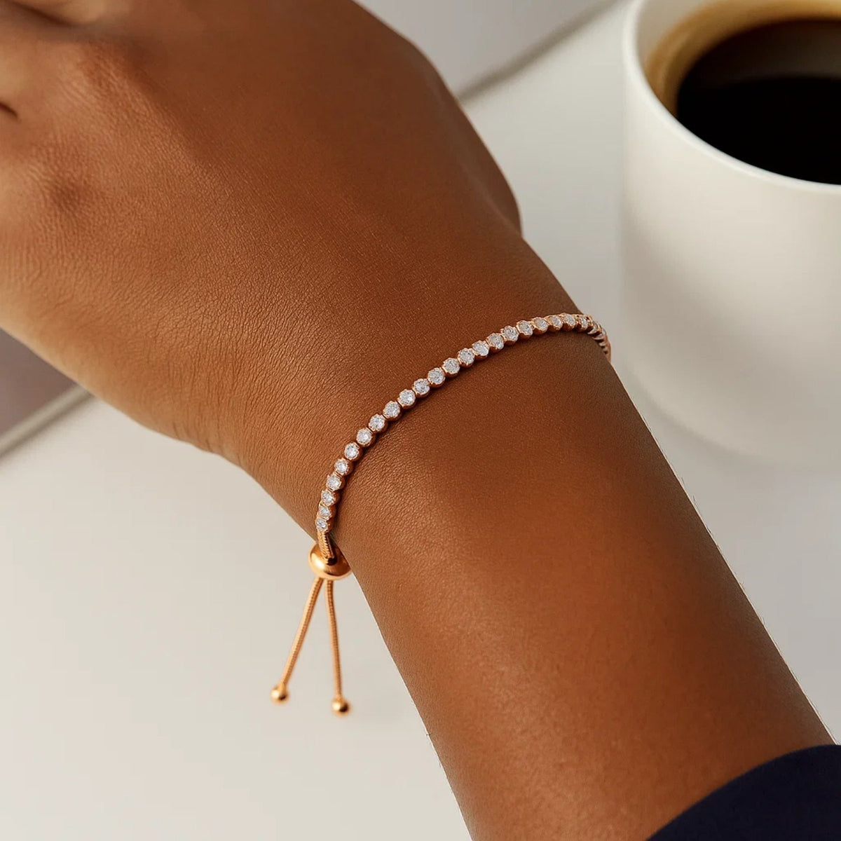 Adjustable sterling silver cubic zirconia tennis bracelet worn on wrist, fine jewelry gifts for her
