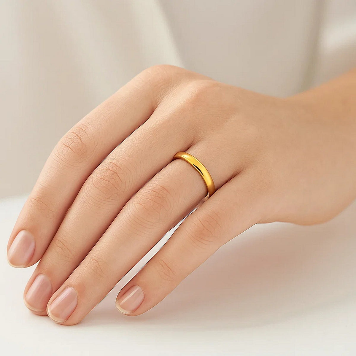Side profile of 14K yellow gold 3mm wide comfort fit wedding band showing band width, fine bridal ring