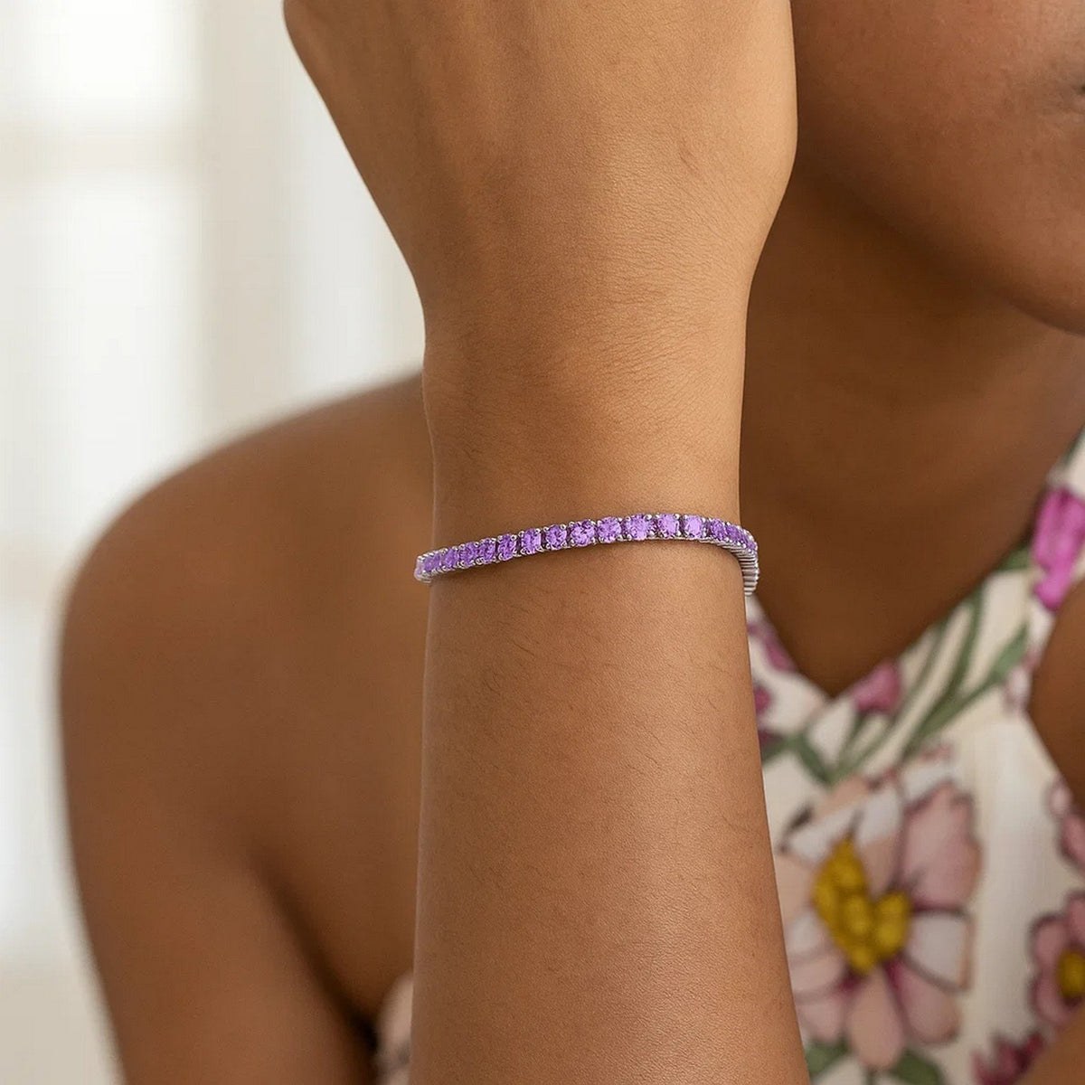 Sterling silver purple CZ tennis bracelet showing continuous stone line and rhodium finish