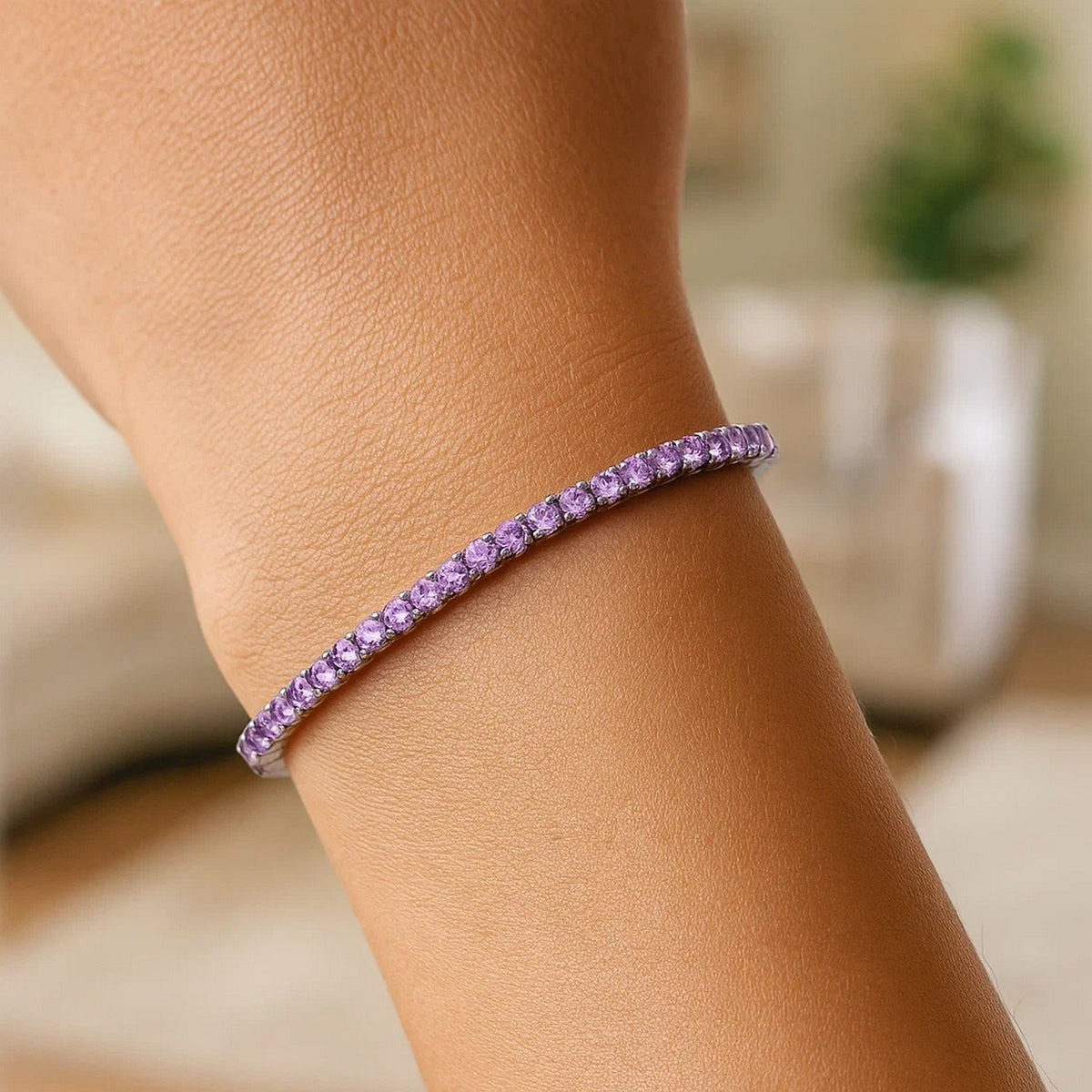 Purple CZ tennis bracelet worn on wrist, lifestyle shot at Savannah Lane Jewelry